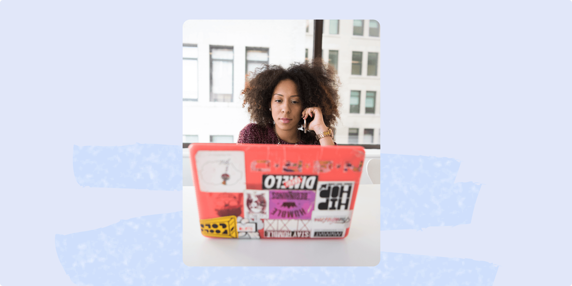 woman on phone and laptop