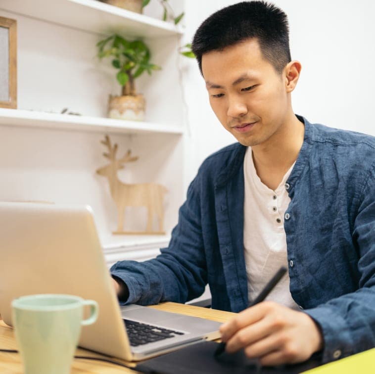 Man working on his computer at home